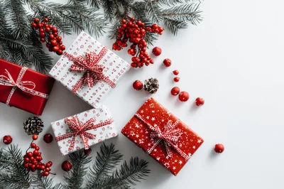 Christmas Gift Boxes With Pine Branches And Berries