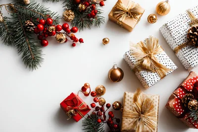 Christmas Gift Boxes and Holiday Decorations on White Background