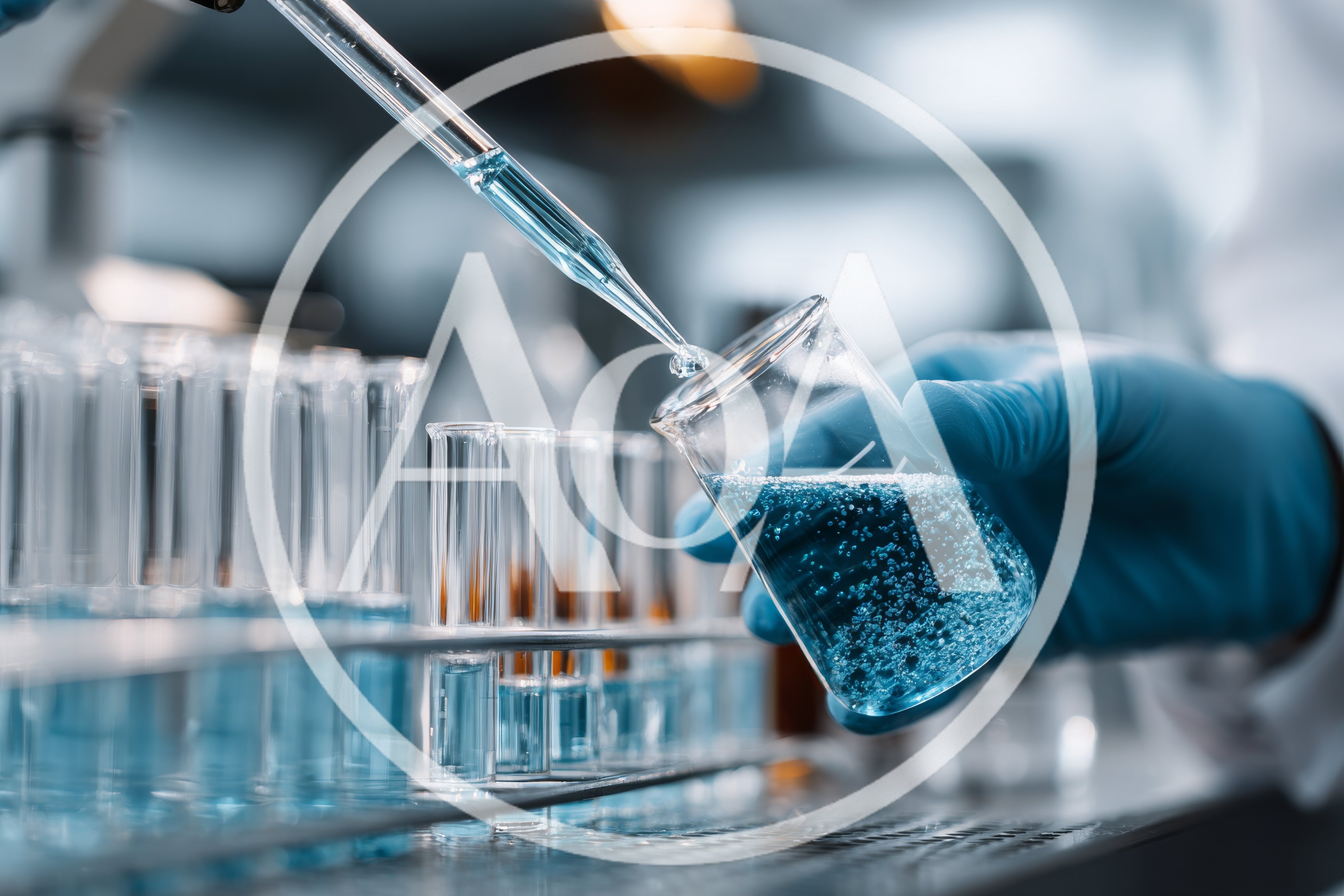 Scientist Adding Blue Liquid To Beaker In Laboratory