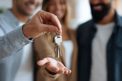 Real Estate Agent Handing Over House Keys