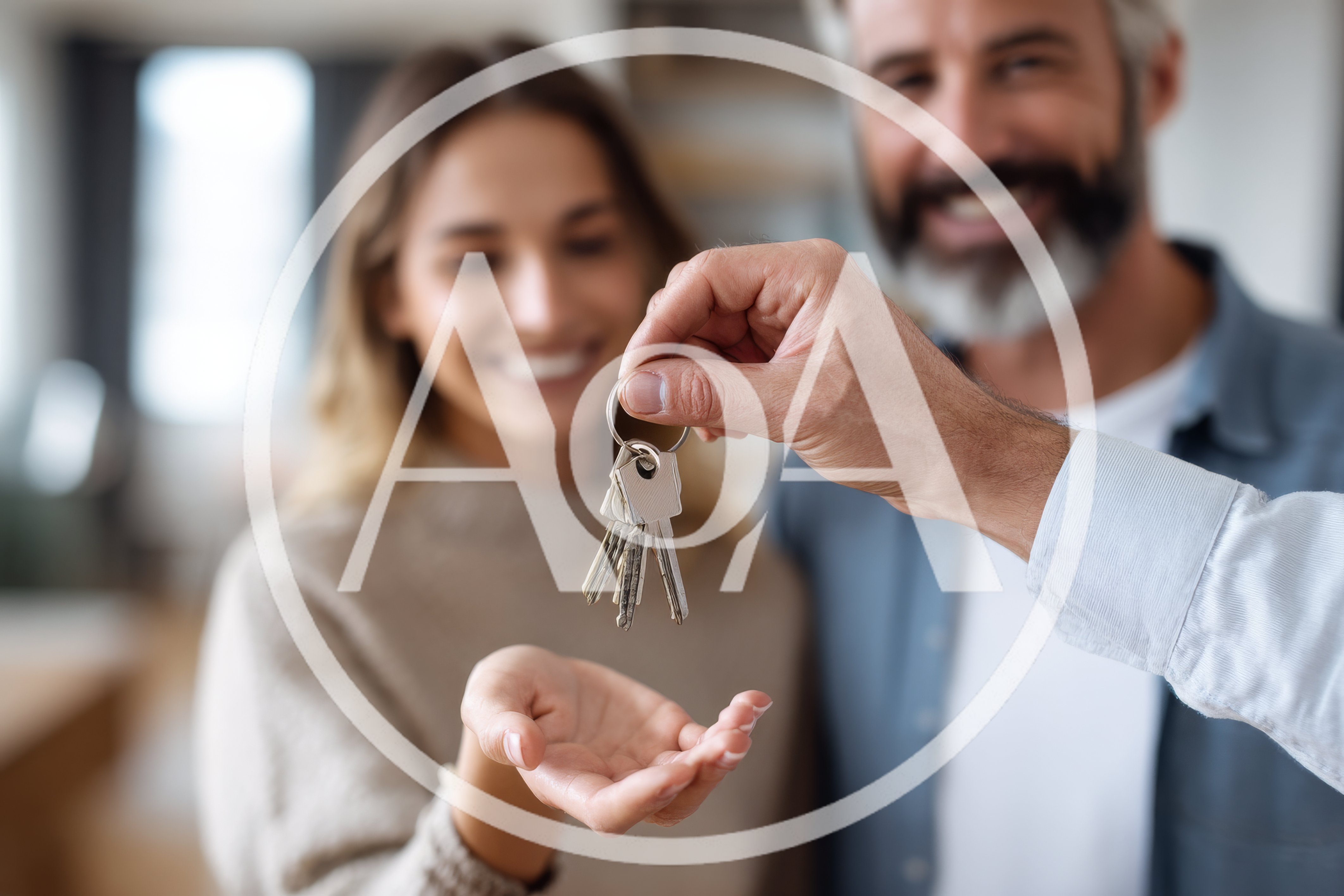 Man Handing Over House Keys To A Woman