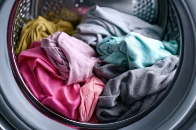 Colorful Laundry Inside A Front Loading Washing Machine