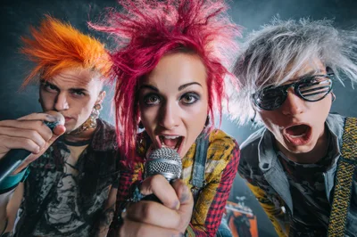 Punk Rock Band Performing With Microphones