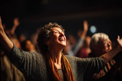 Middle Aged Woman Worshipping With Arms Raised In Church