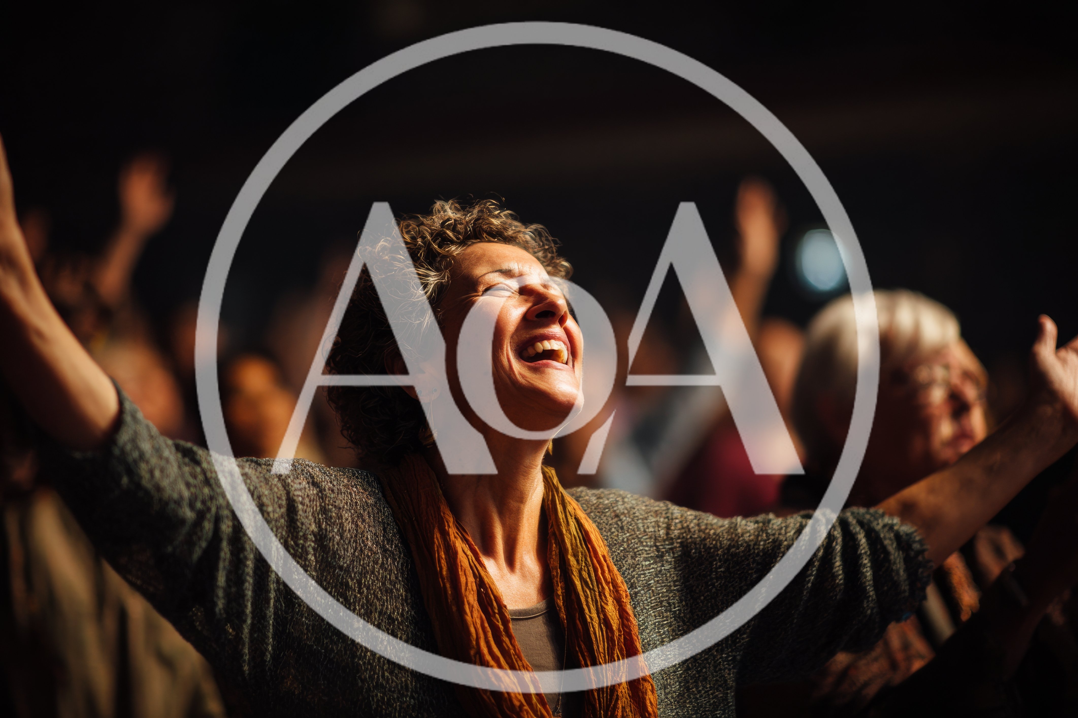 Middle Aged Woman Worshipping With Arms Raised In Church