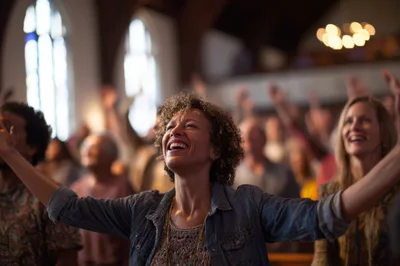 Diverse Congregation Worshipping With Raised Hands In Church