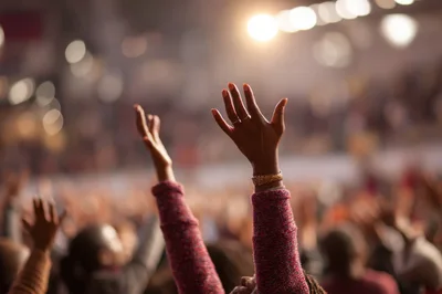 Audience Members Raising Hands During A Live Concert