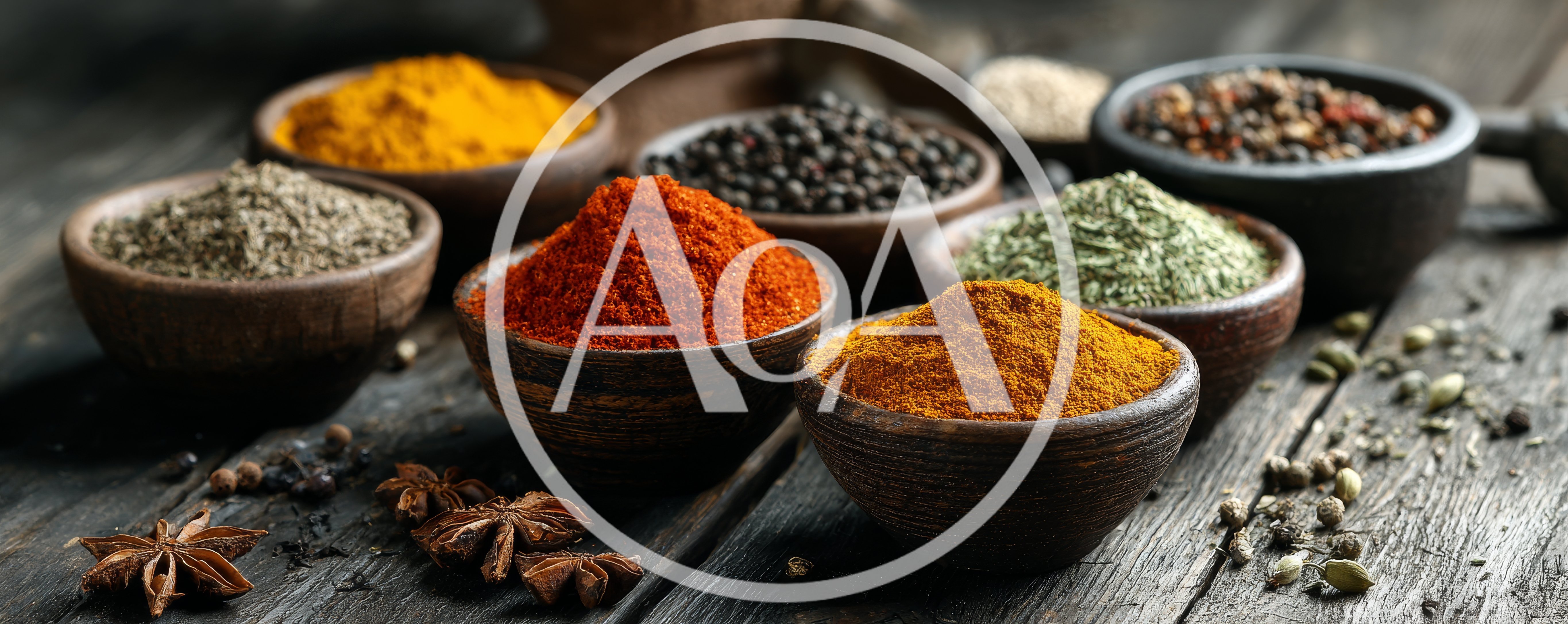 Assorted Spices In Wooden Bowls On Rustic Table