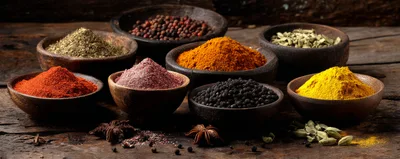 Assorted Spices and Herbs in Wooden Bowls