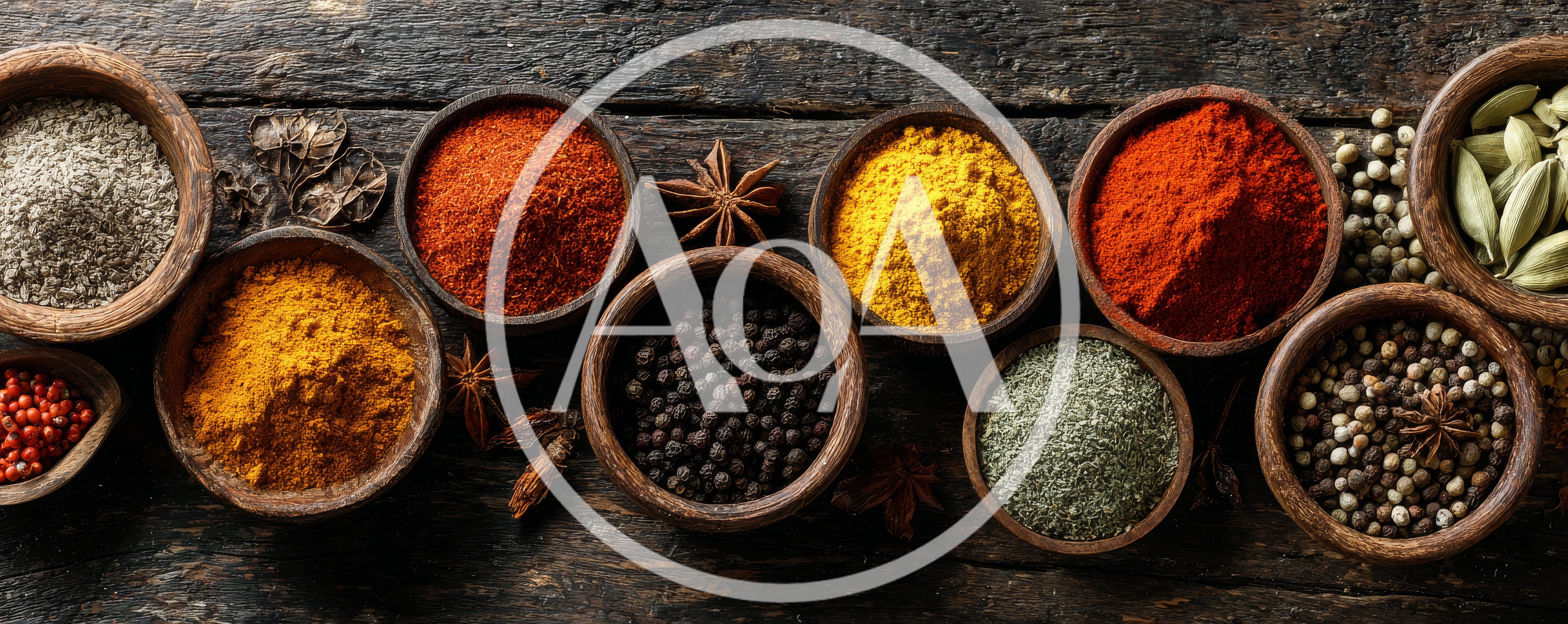 Assorted Spices In Wooden Bowls On Rustic Table