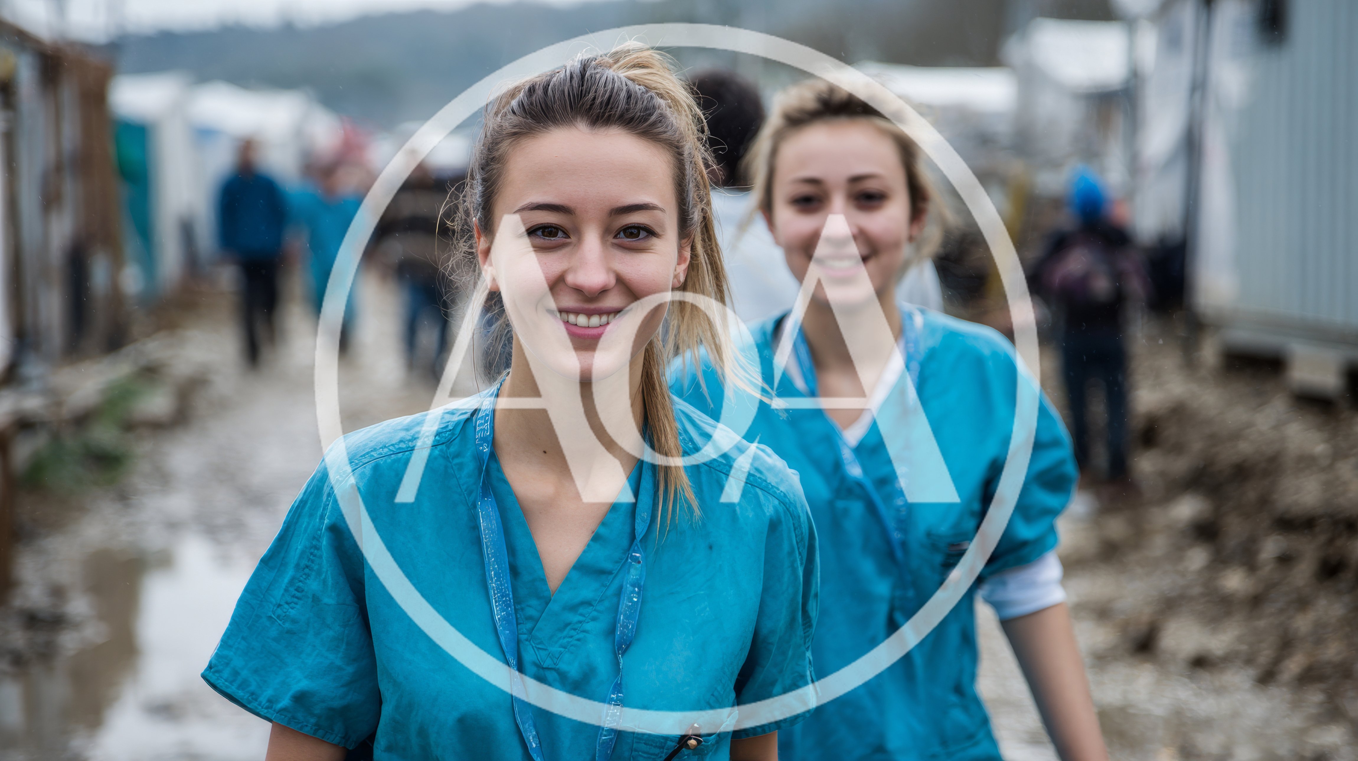 Two Female Medical Volunteers Walking Through Refugee Camp
