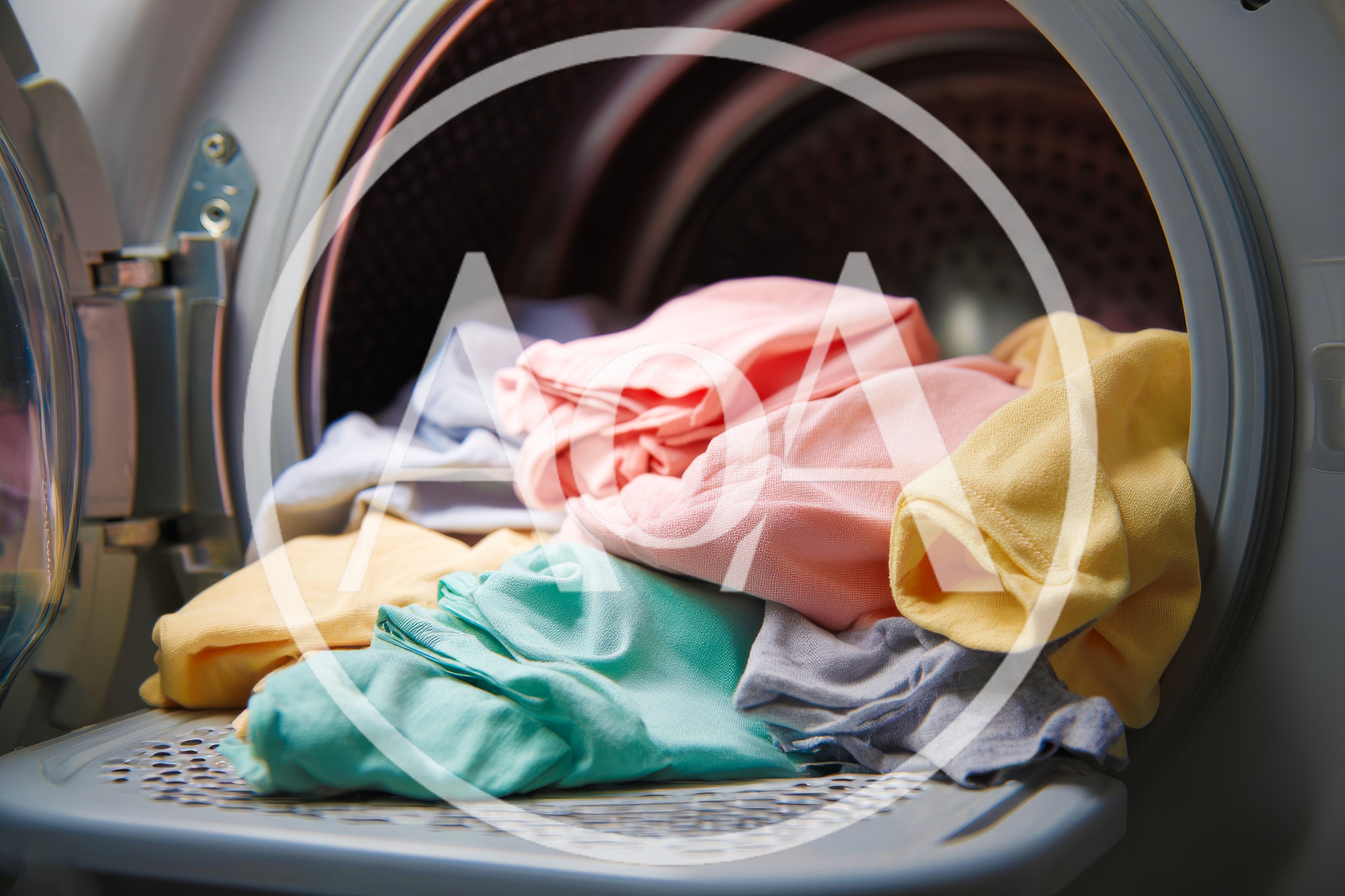 Colorful Laundry Inside An Open Clothes Dryer