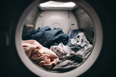 Inside View Of A Clothes Dryer With Laundry