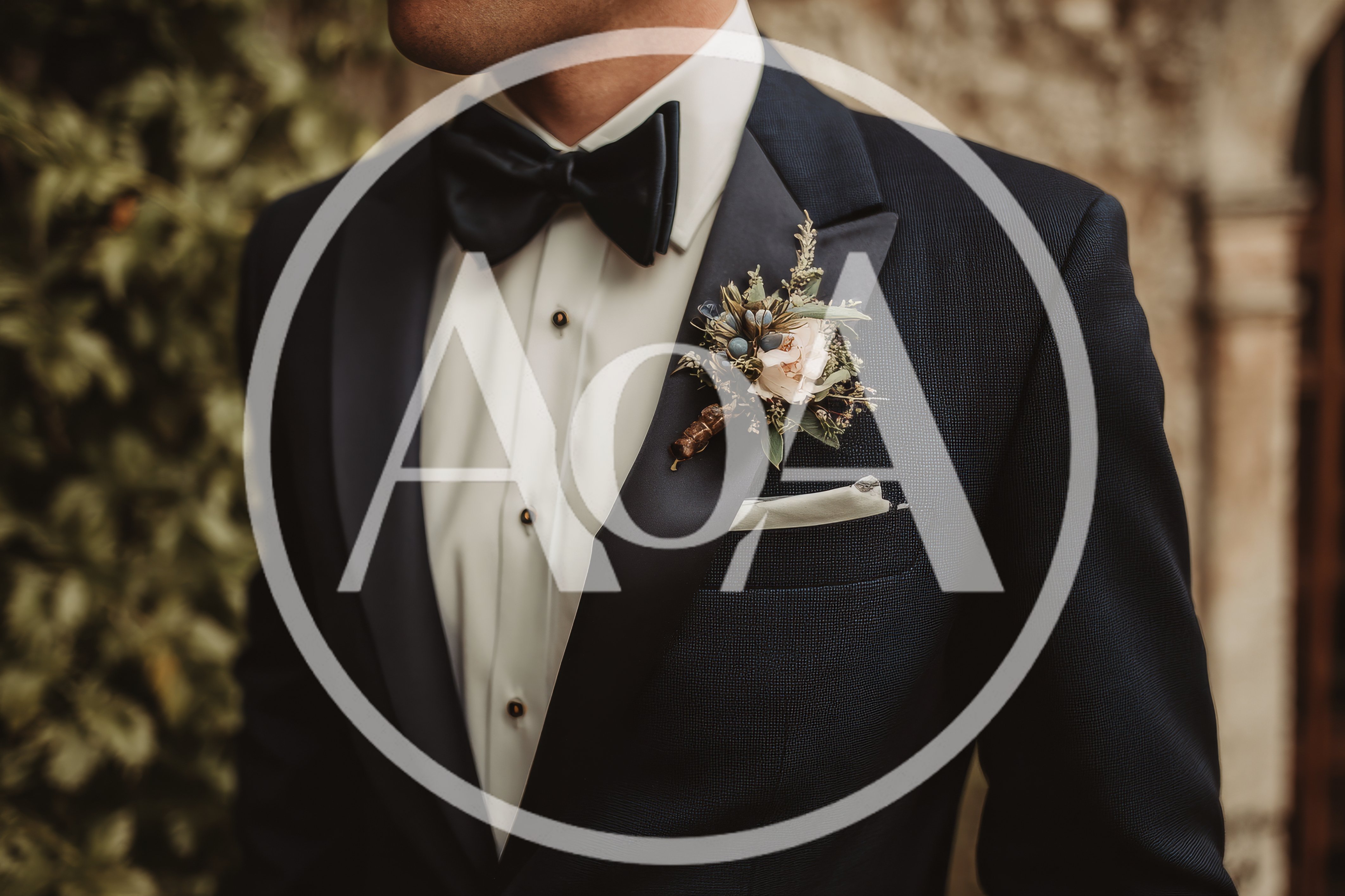 Groom Wearing A Navy Tuxedo With Floral Boutonniere
