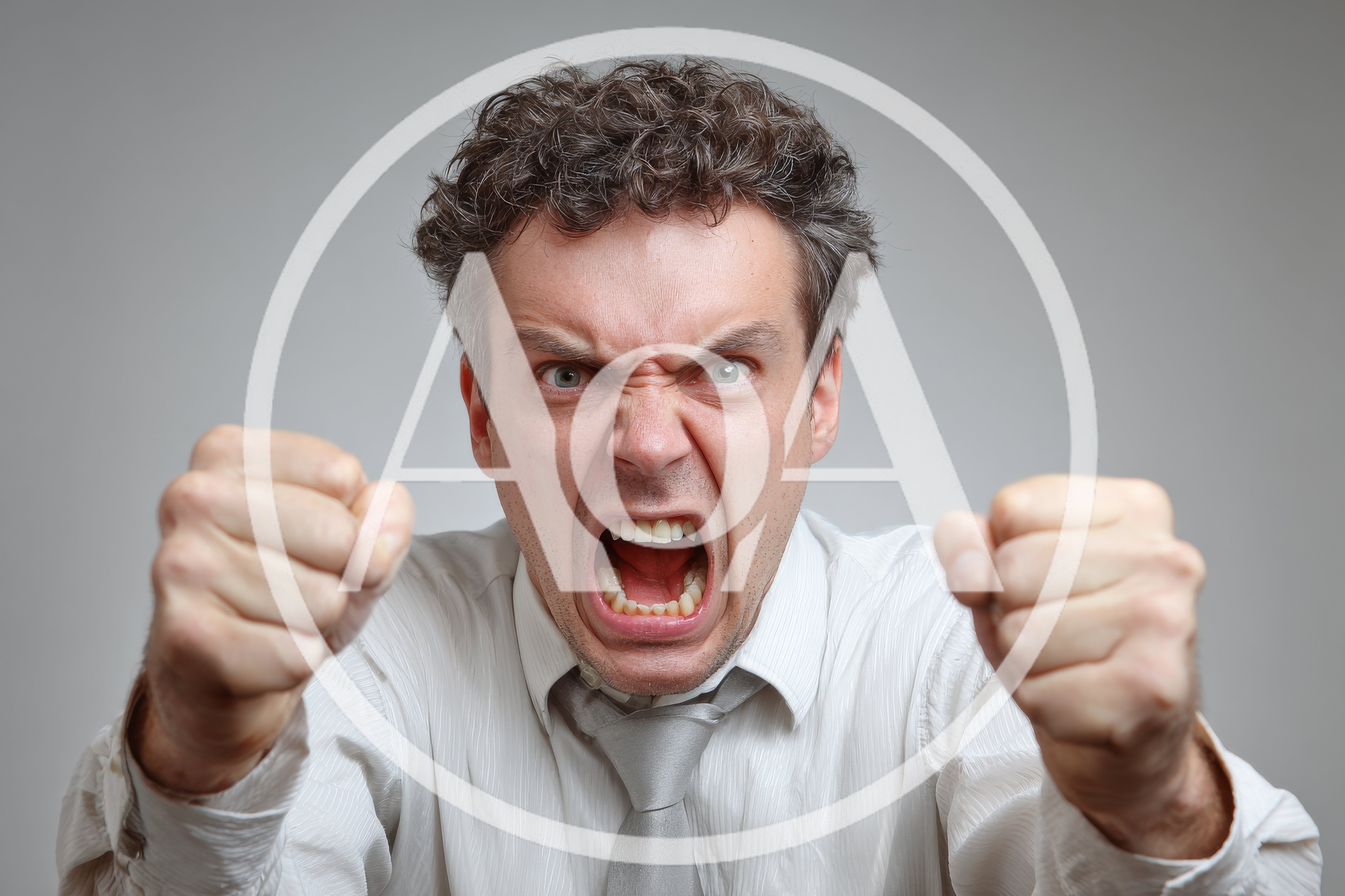 Angry Man Screaming With Clenched Fists