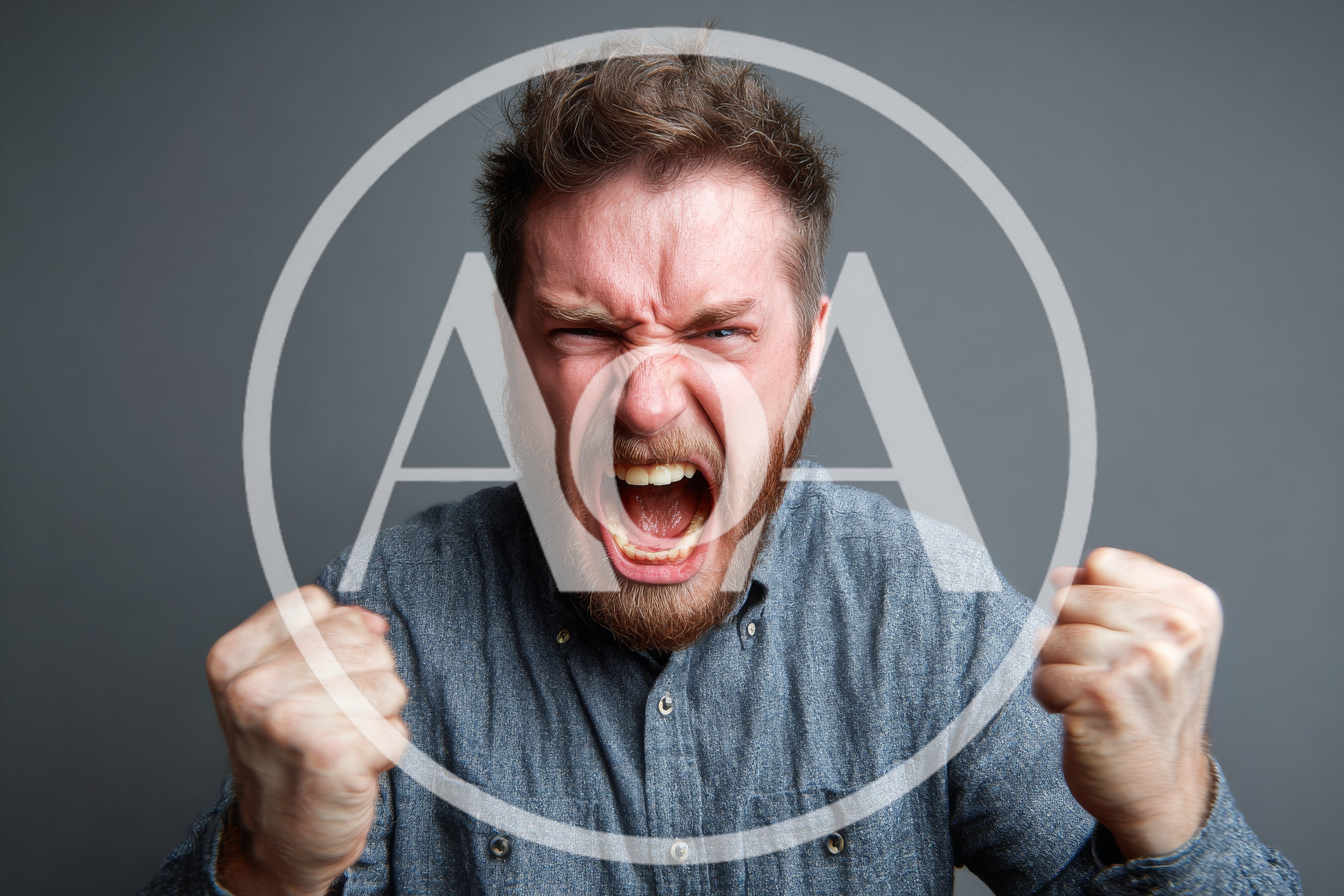 Angry Man Screaming With Clenched Fists