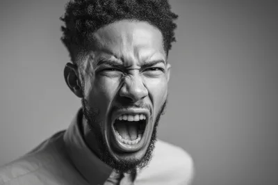 Portrait Of An Angry Man Screaming In Black And White
