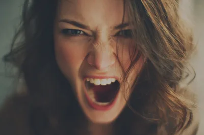 Close Up Portrait Of An Angry Screaming Woman