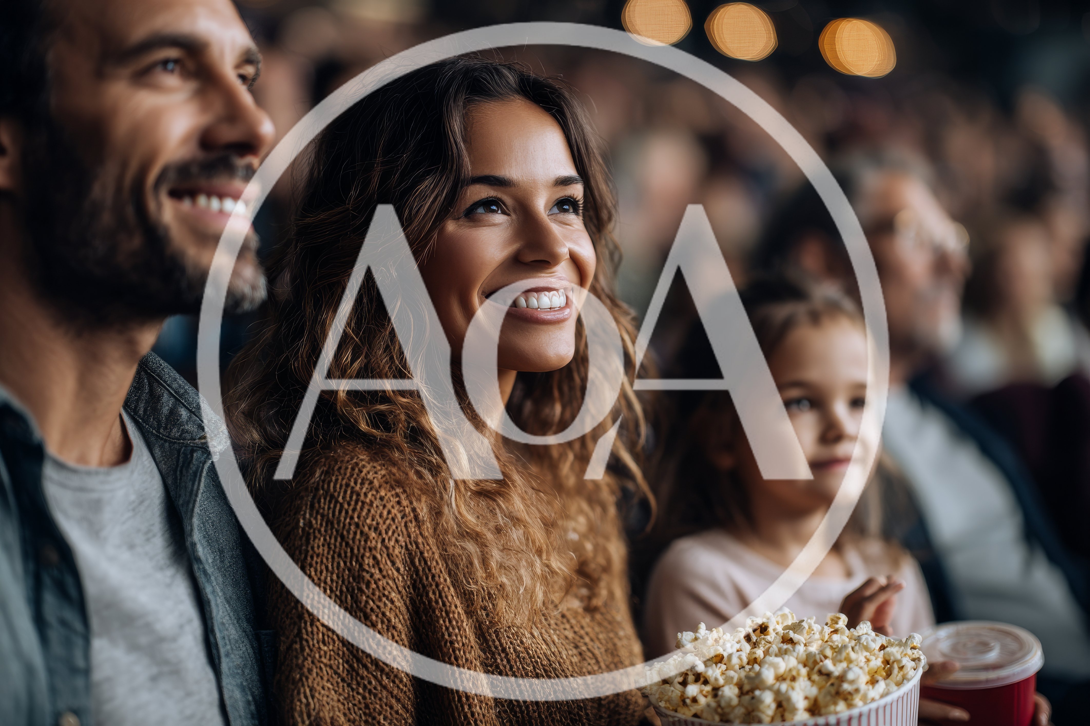 Family Enjoying A Movie In A Crowded Theater