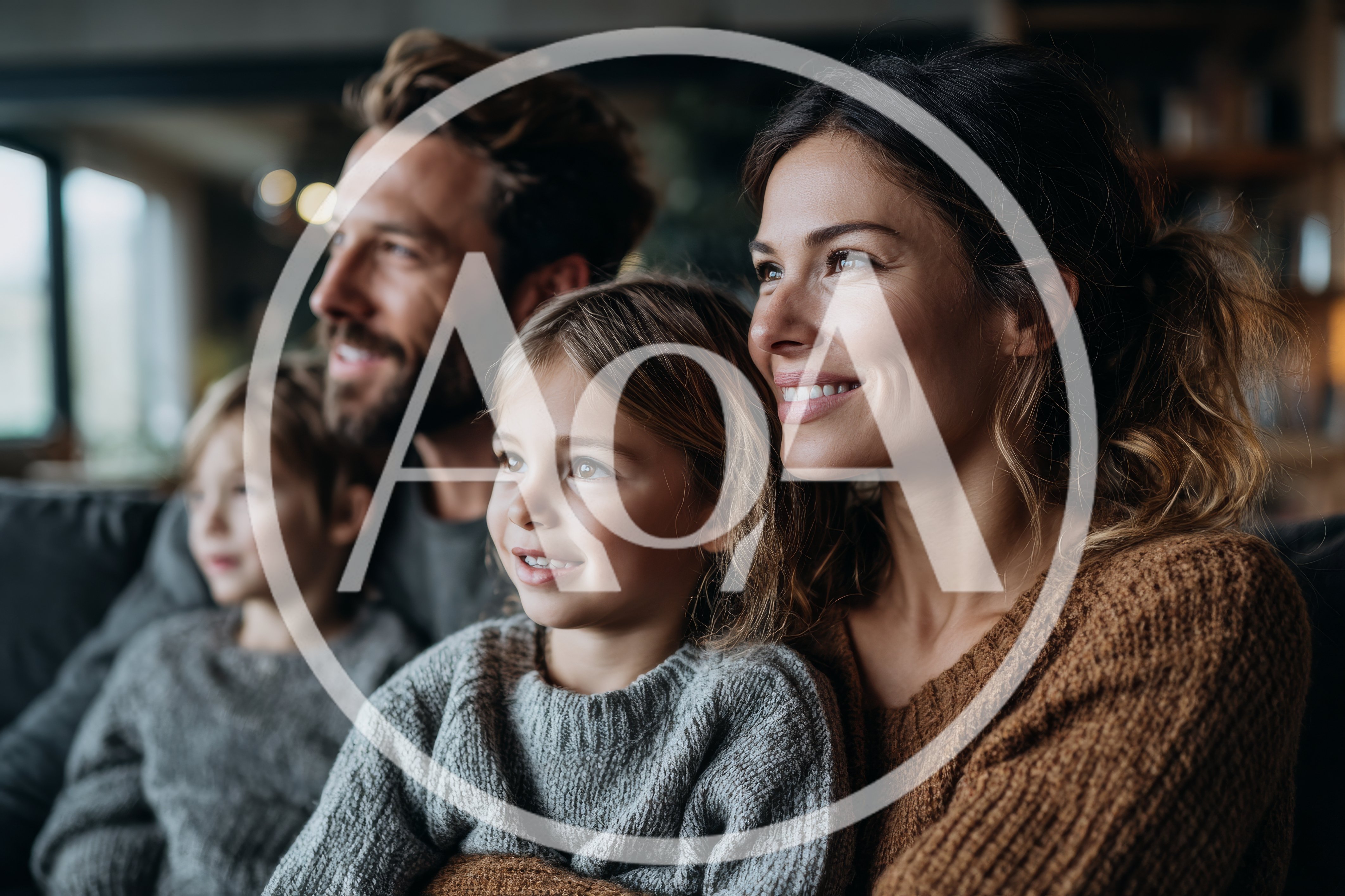 Happy Family Watching Television Together At Home