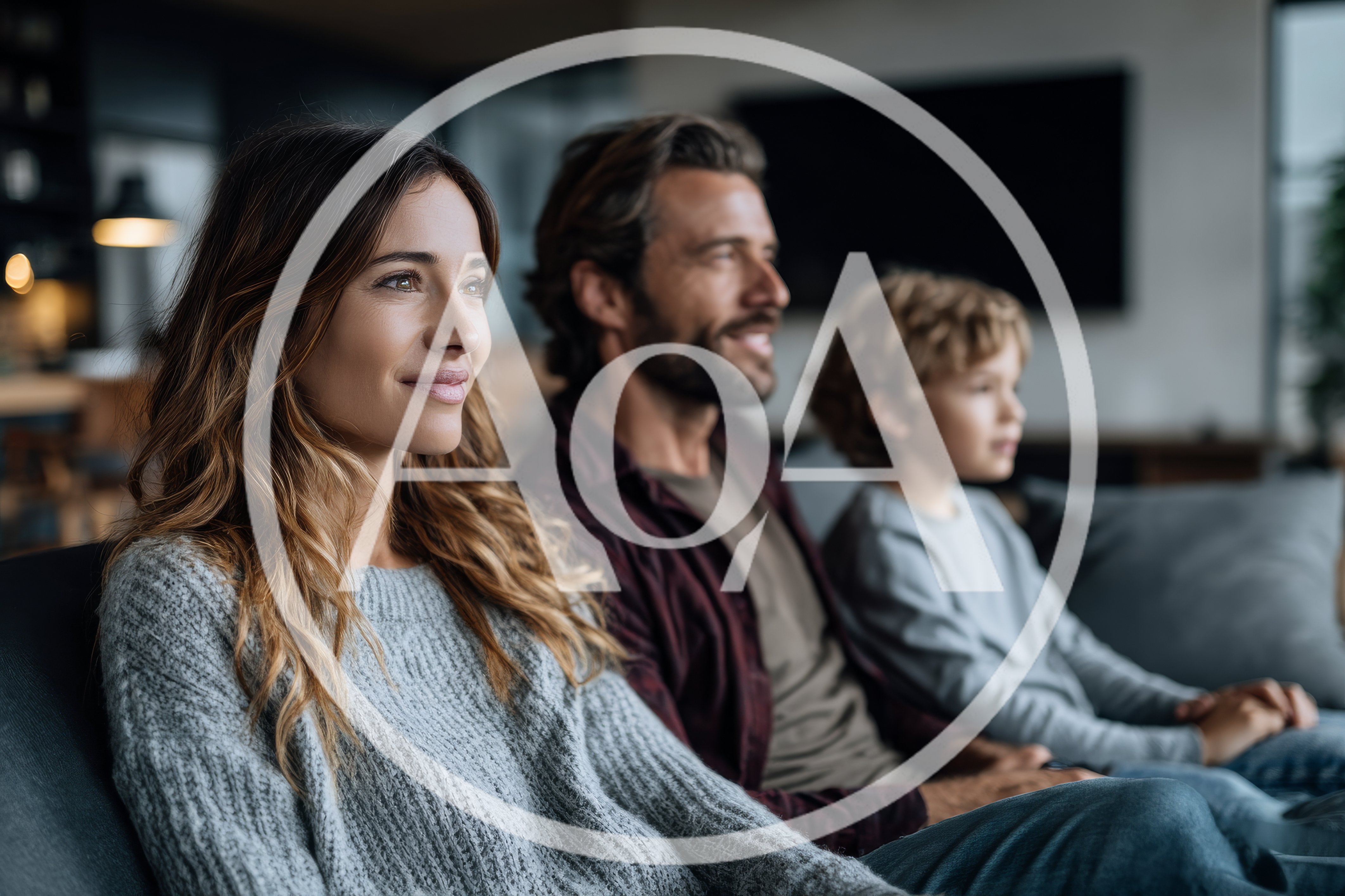 Family Watching Television Together In Living Room