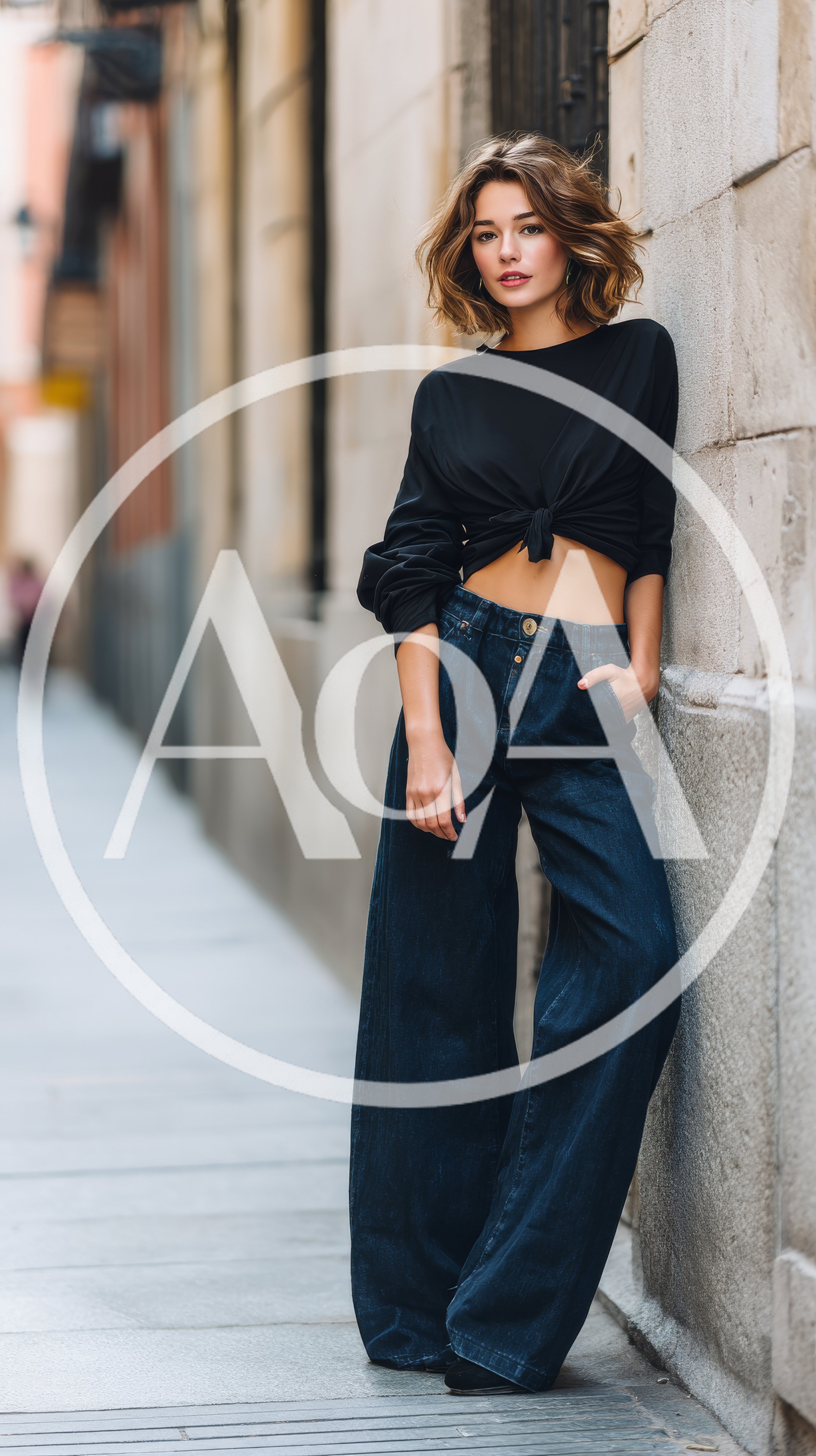 Stylish Young Woman Posing Against A Stone Wall