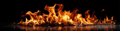 Bright Orange Flames Burning On Dark Reflective Surface