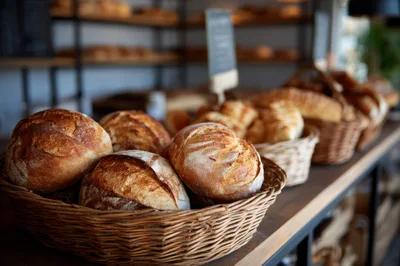 Freshly Baked Artisan Bread Loaves In Wicker Baskets