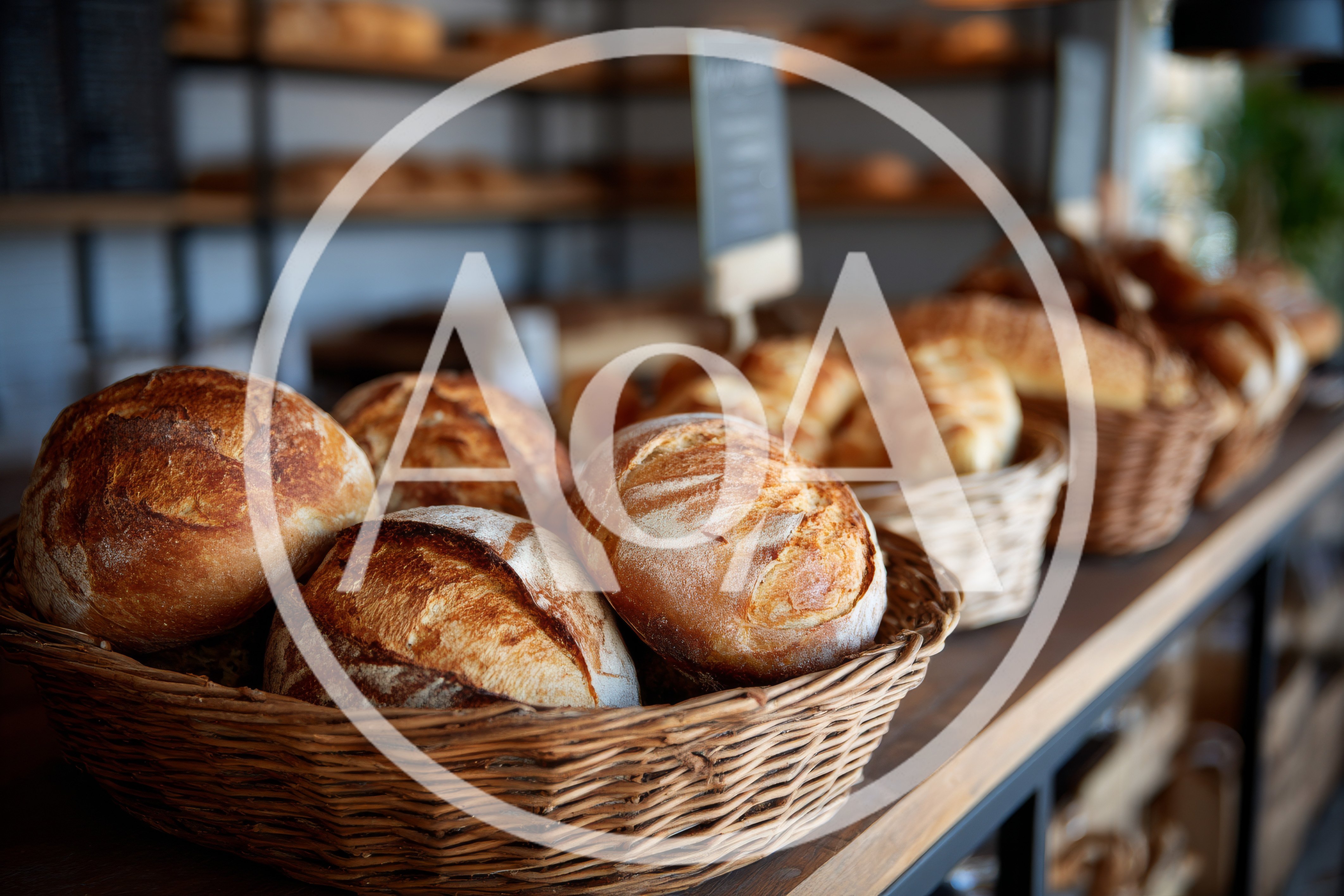 Freshly Baked Artisan Bread Loaves In Wicker Baskets