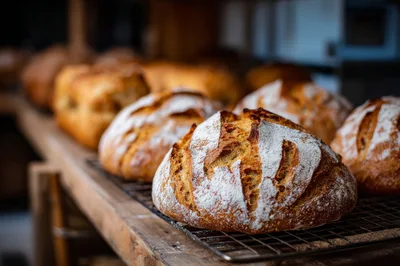 Freshly Baked Sourdough Loaves On A Cooling Rack