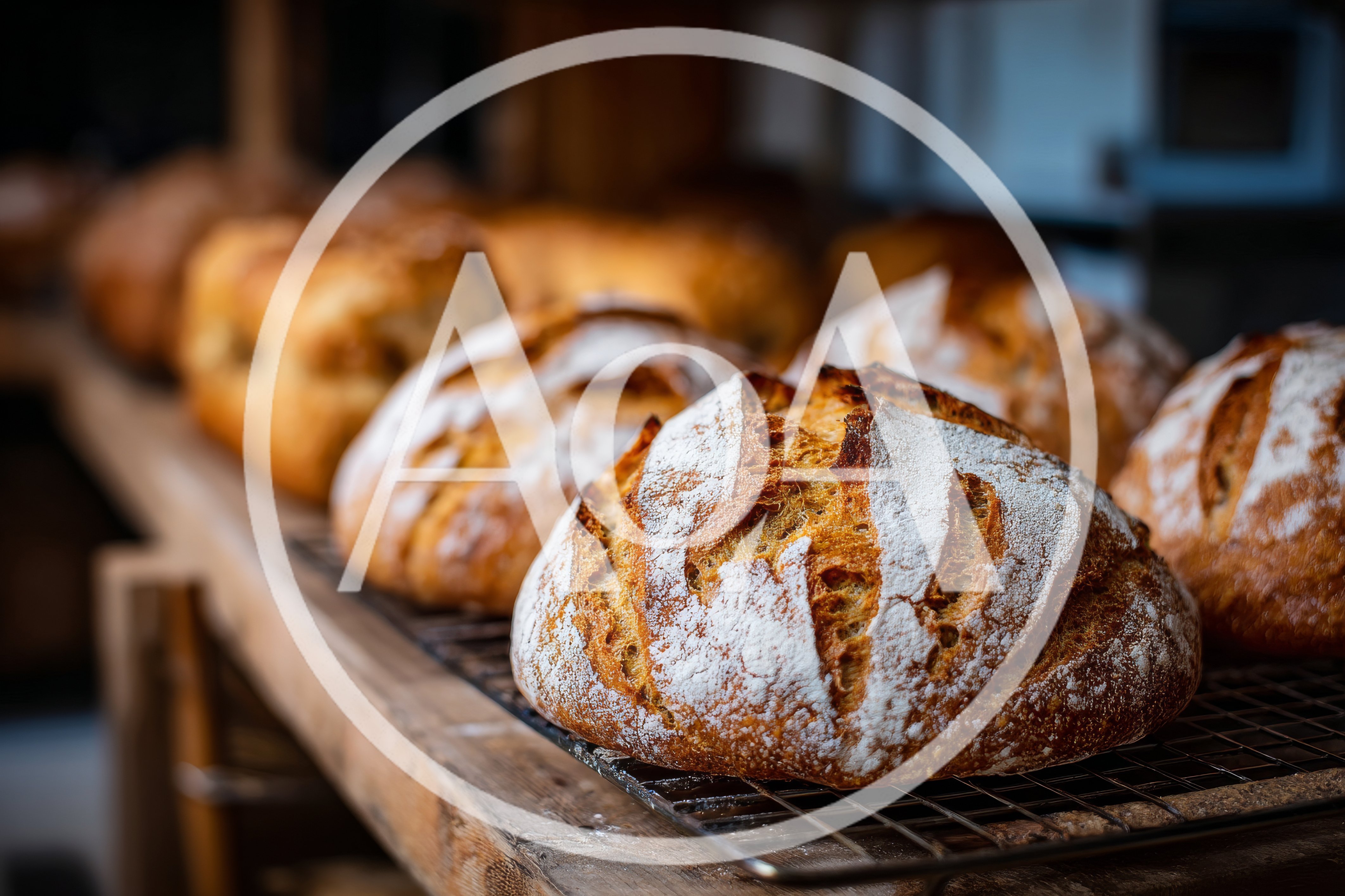 Freshly Baked Sourdough Loaves On A Cooling Rack