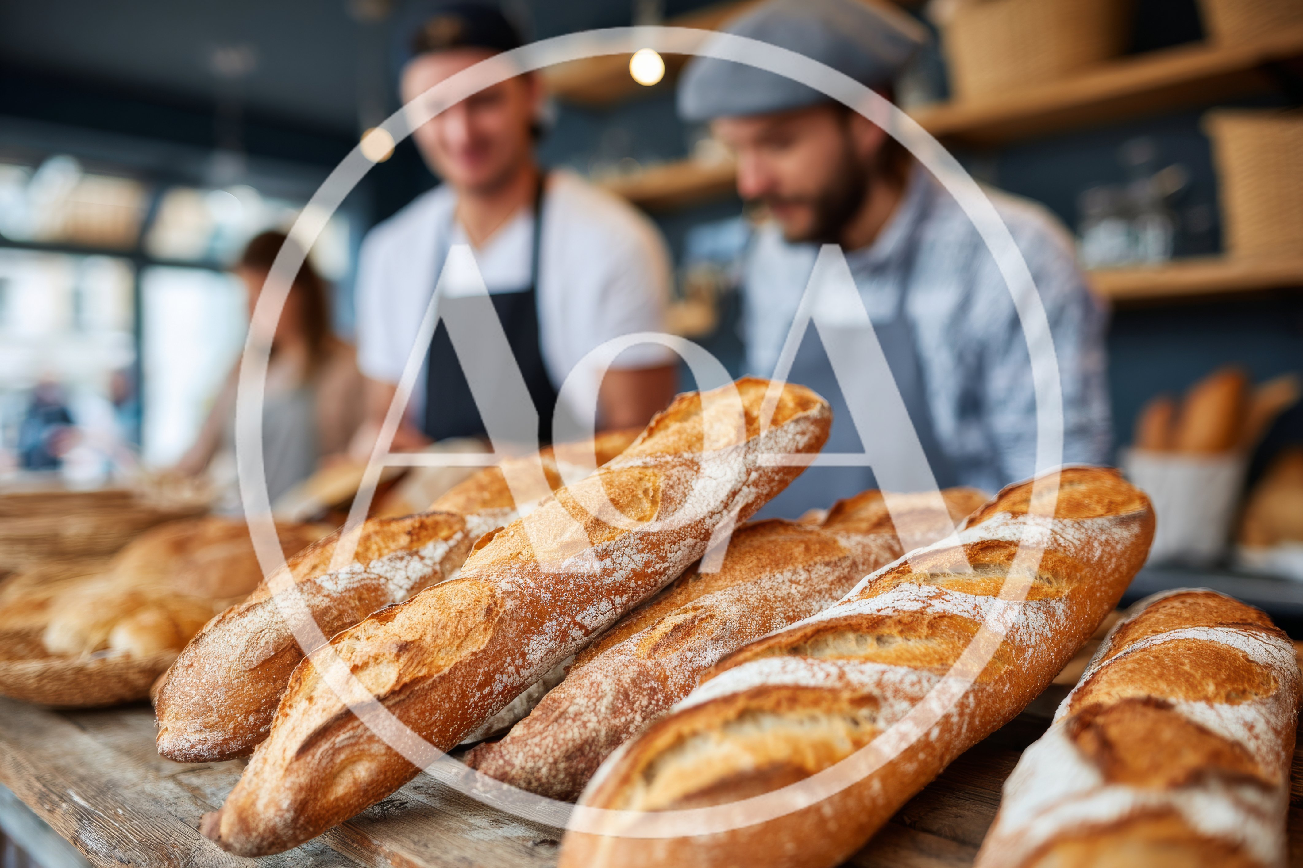 Artisan Bakers Preparing Fresh Baguettes In A Bakery