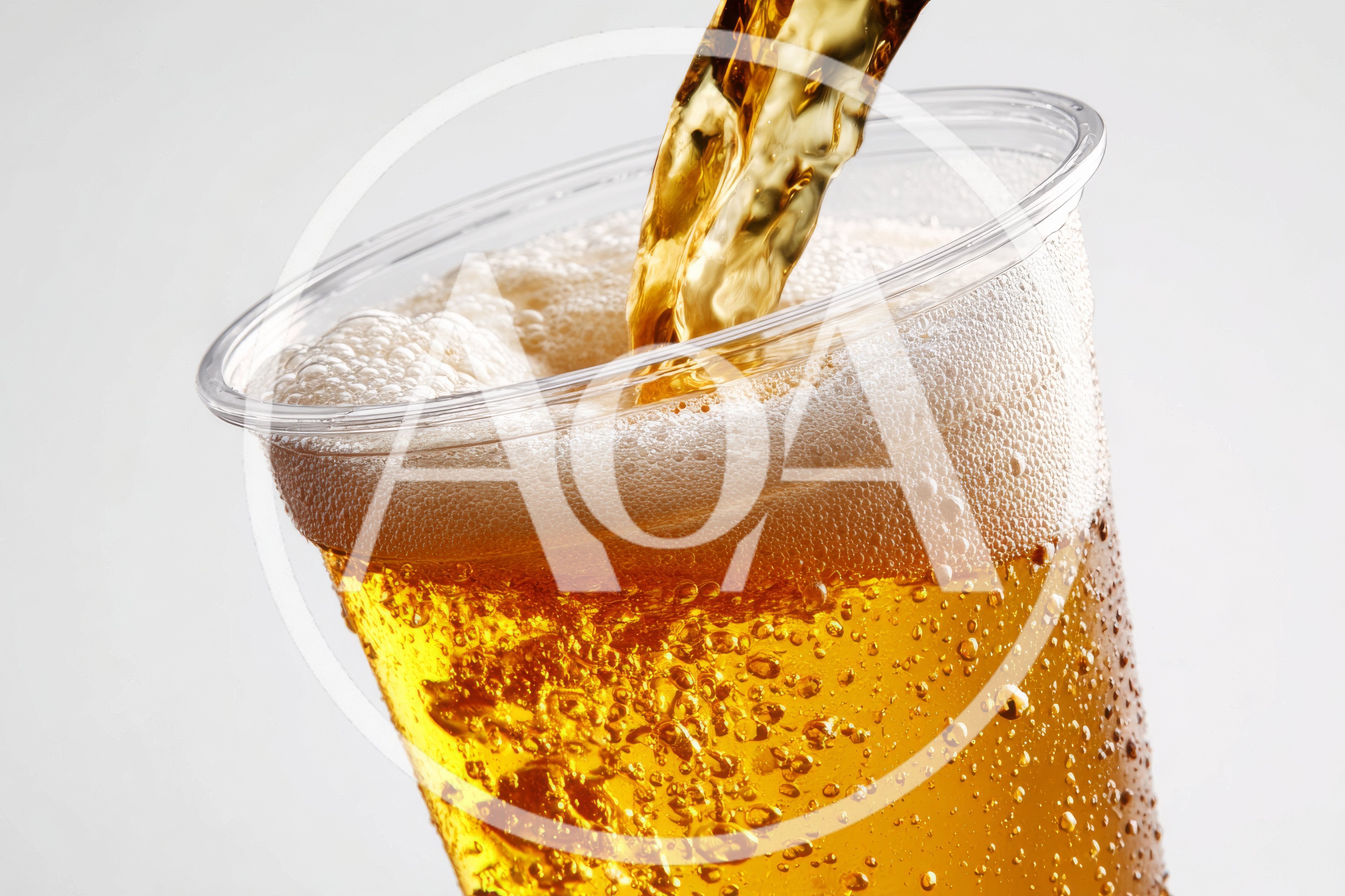 Golden Beer Pouring Into A Clear Plastic Cup