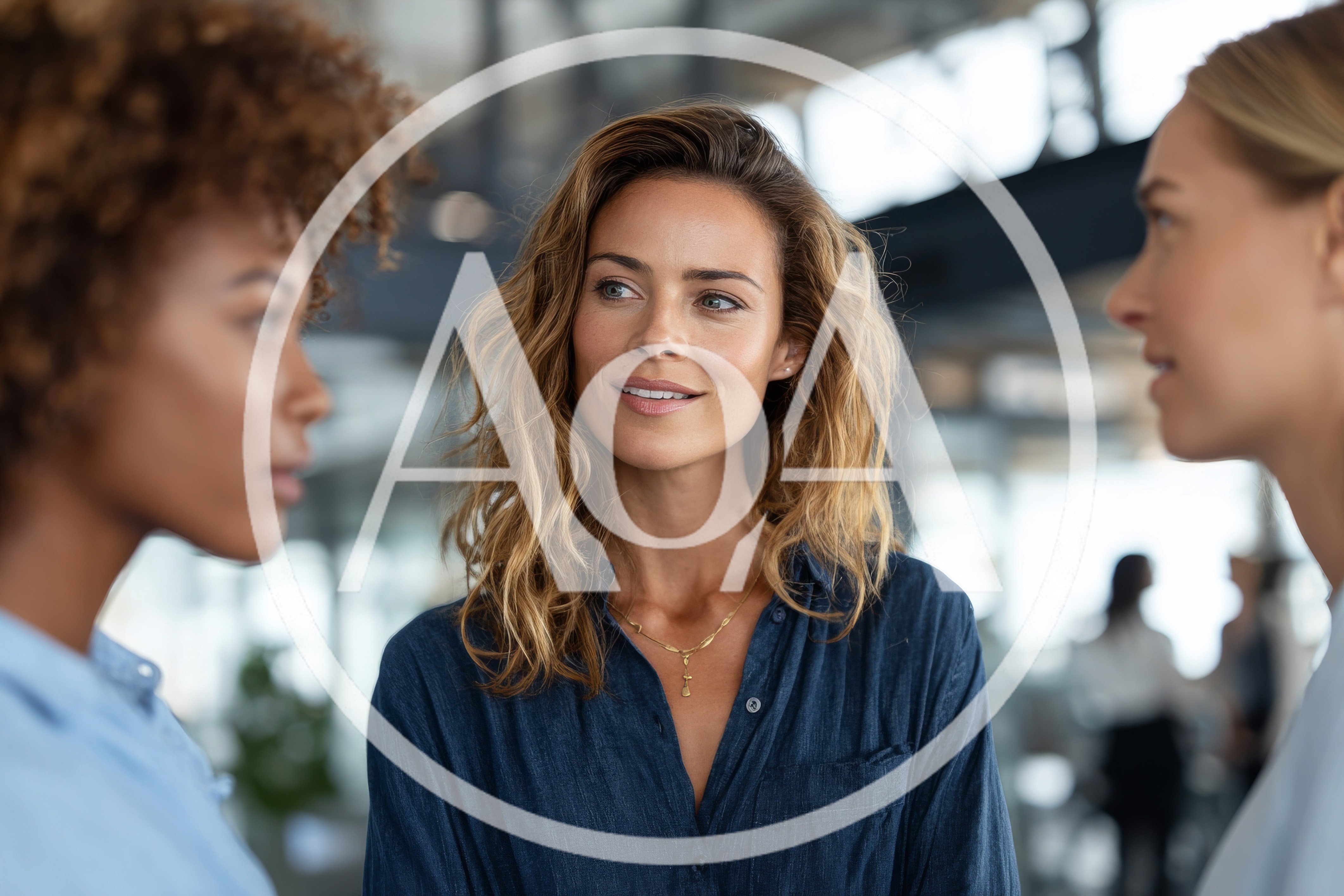 Three Professional Women Collaborating In A Modern Office