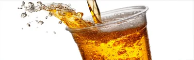 Golden Beer Pouring Into A Clear Plastic Cup