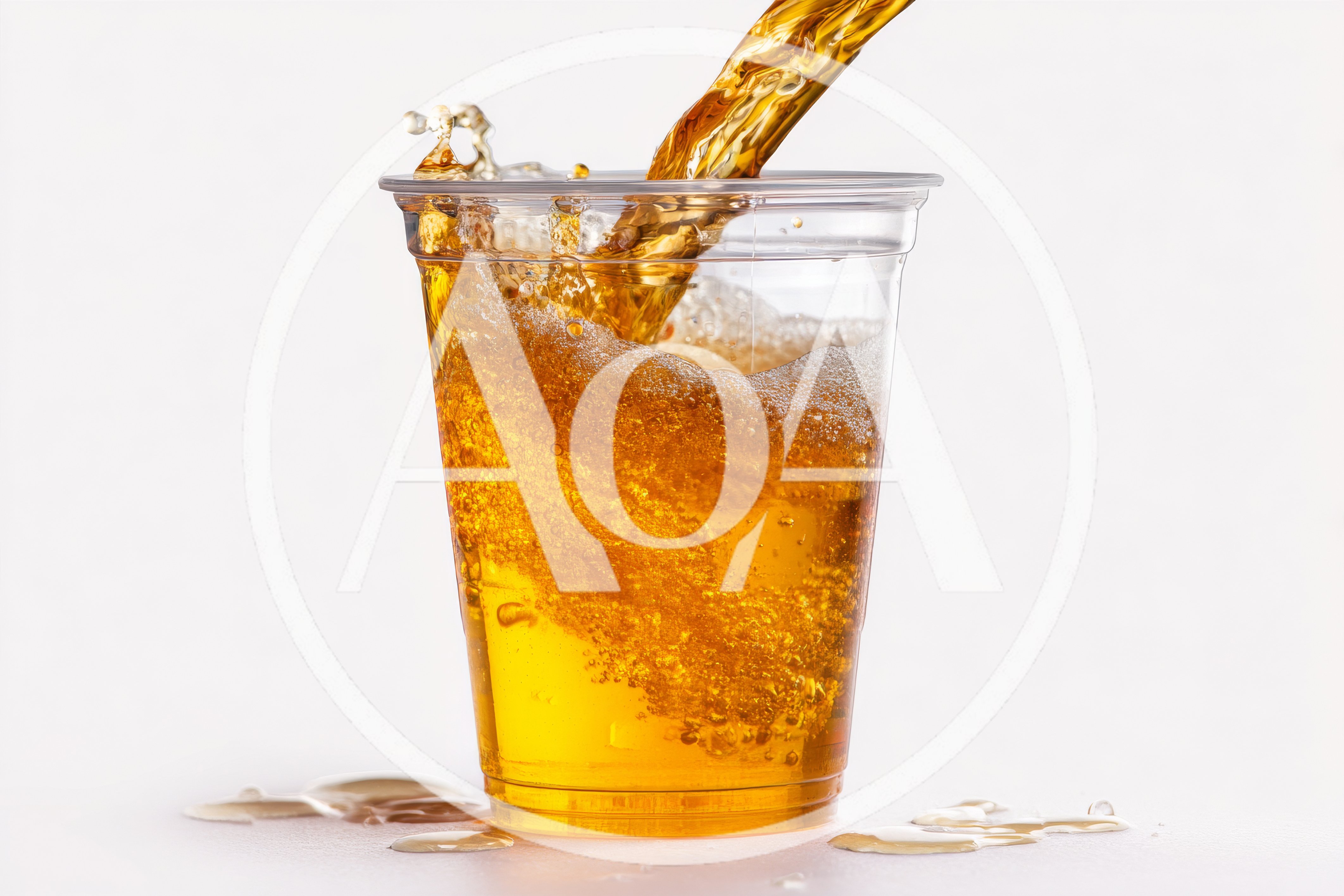 Golden Liquid Pouring Into A Clear Plastic Cup