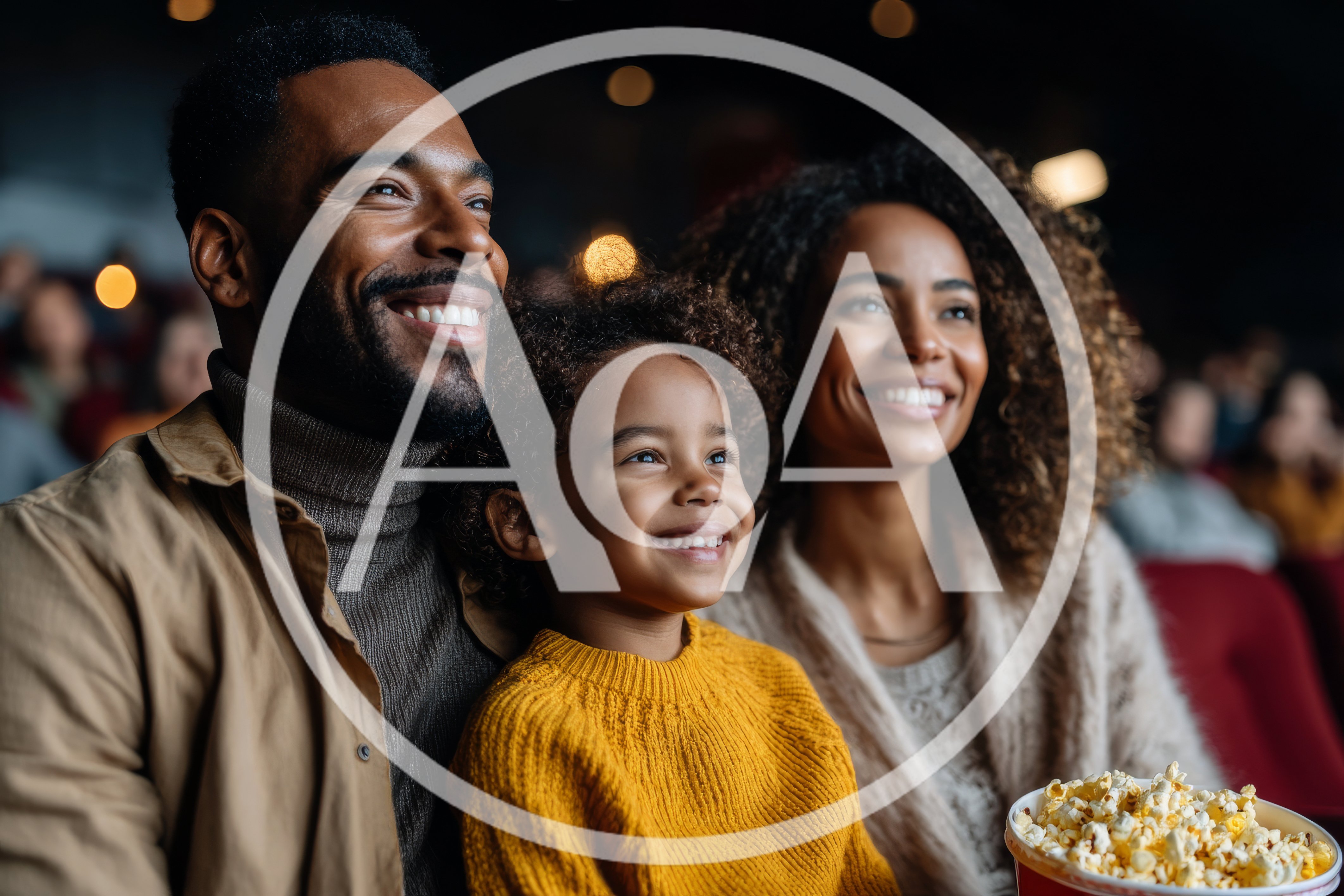 Happy Family Watching A Movie In A Cinema
