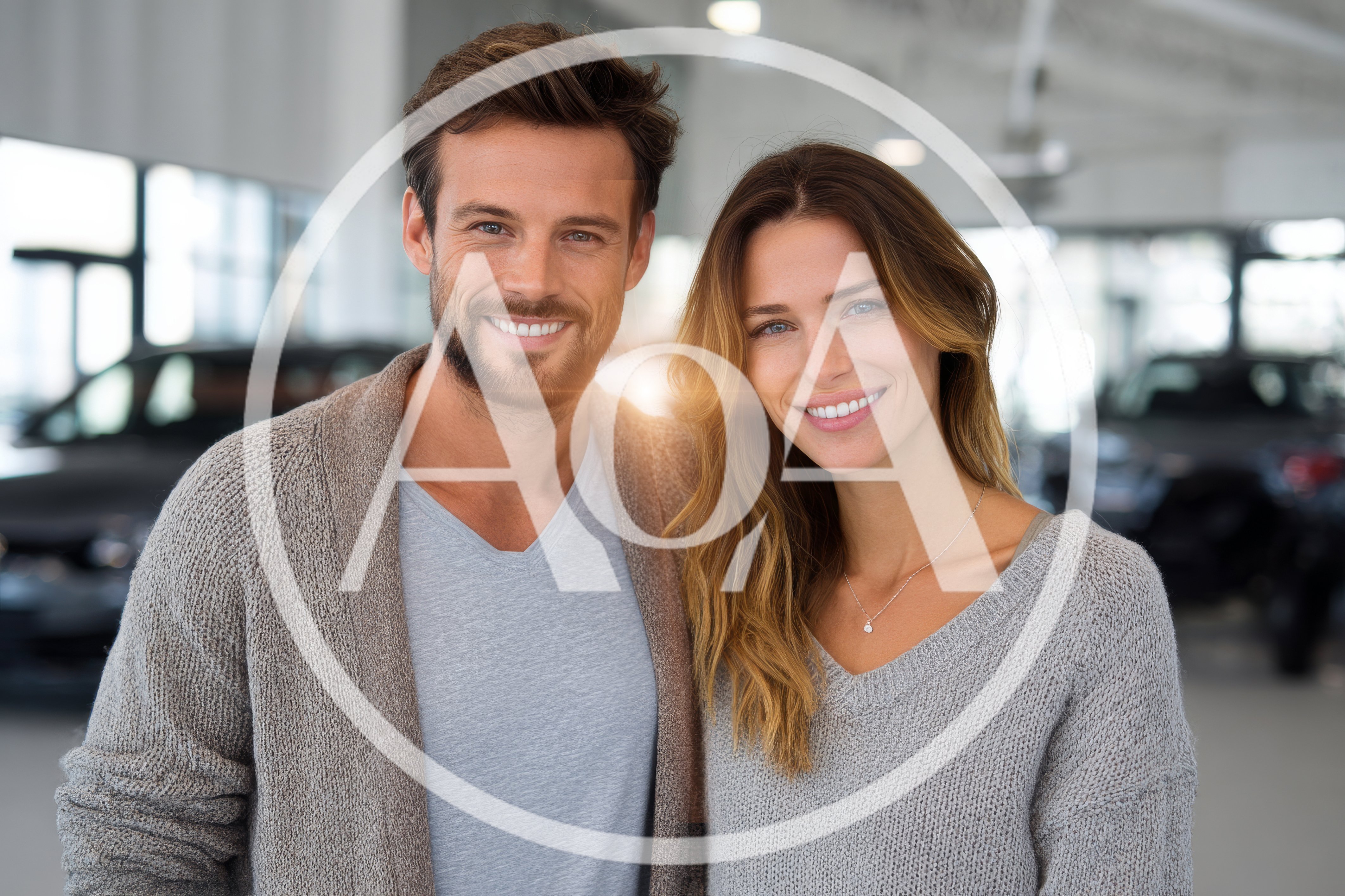 Happy Couple Smiling Together in a Car Dealership