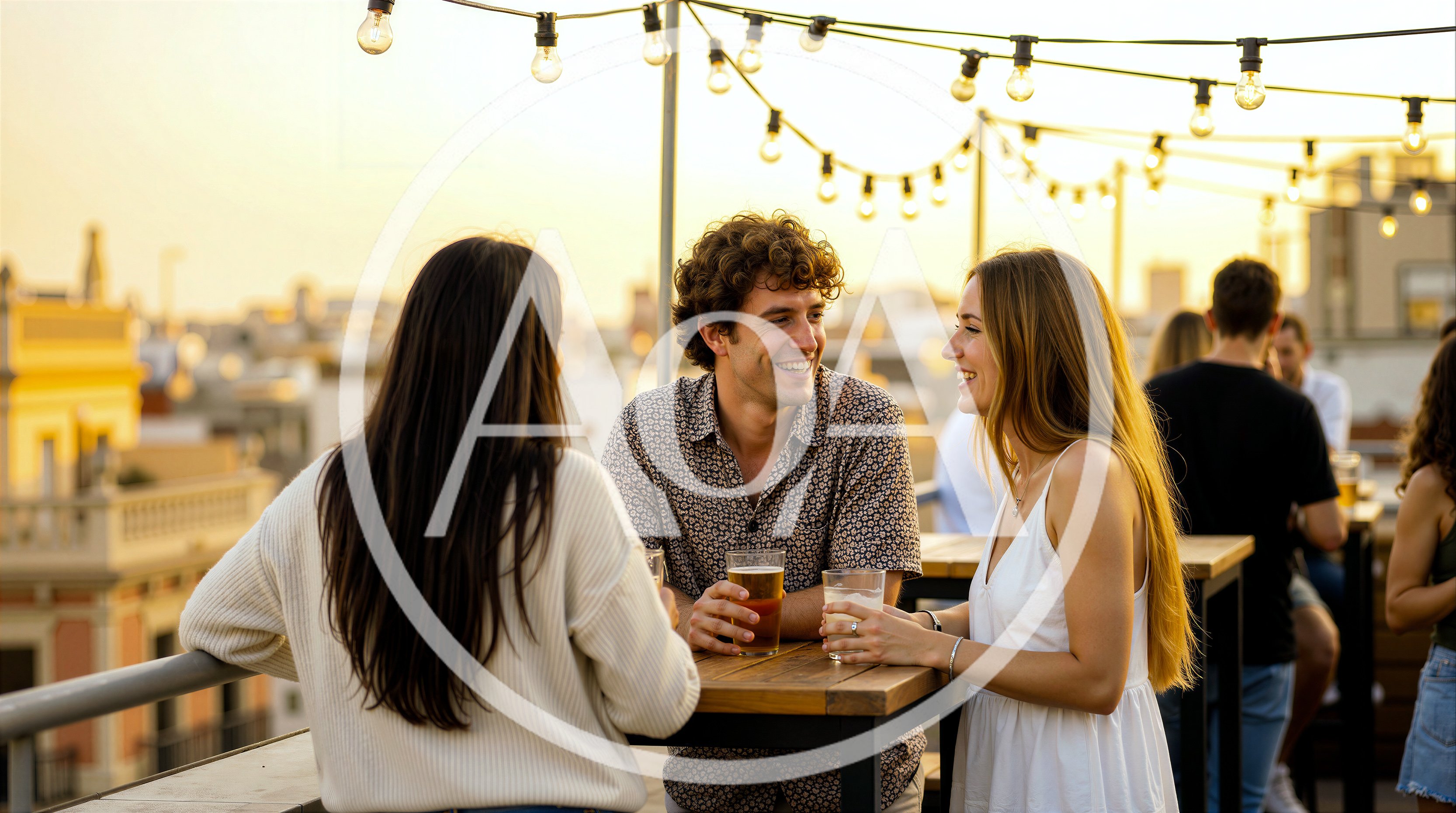 Friends Socializing With Drinks On A Rooftop Terrace