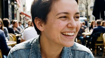 Young Woman Laughing At An Outdoor Cafe
