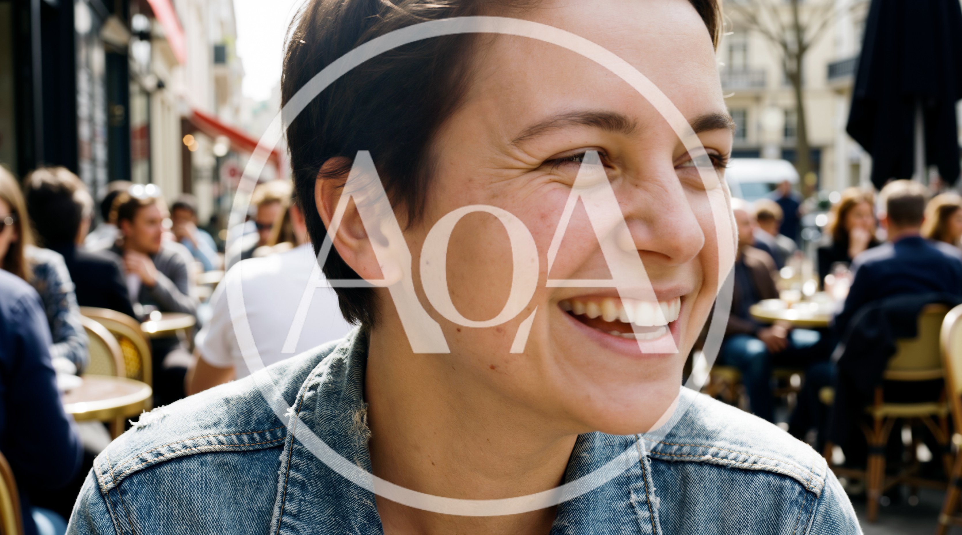 Young Woman Laughing At An Outdoor Cafe
