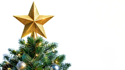 Golden Star Topper On A Decorated Christmas Tree