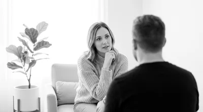 Woman Listening Attentively During A Professional Therapy Session