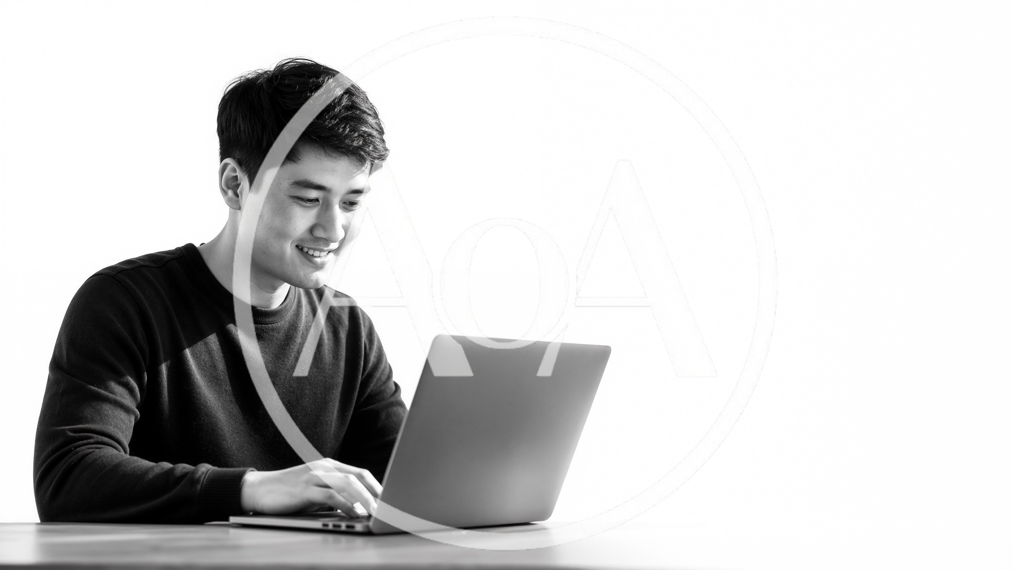Young Asian Man Working On Laptop Computer