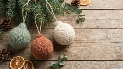 Knitted Christmas Ornaments on Rustic Wooden Background