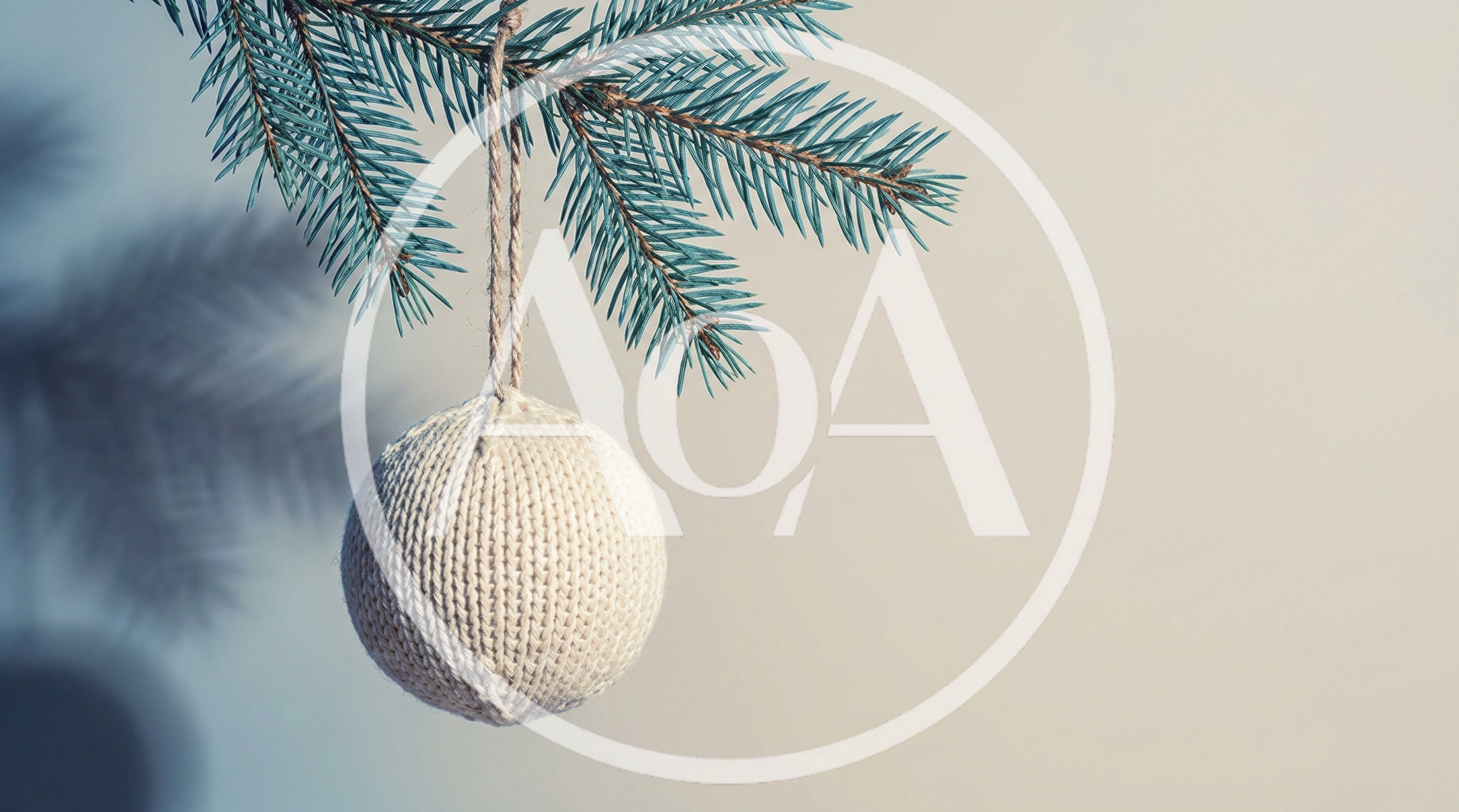 Knitted Christmas Ornament Hanging From A Pine Branch