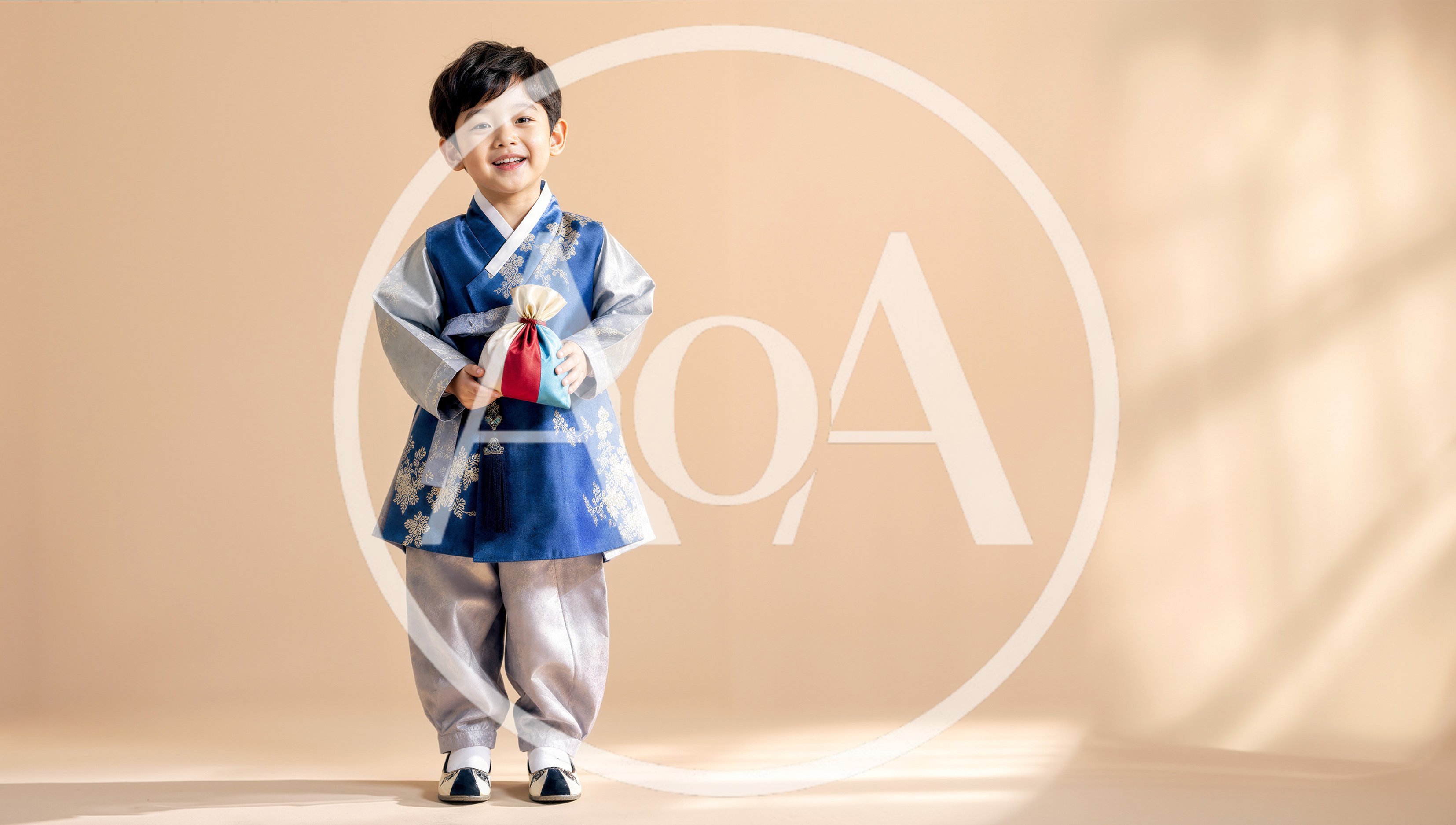 Young Korean Boy Wearing Traditional Hanbok Holding Lucky Pouch