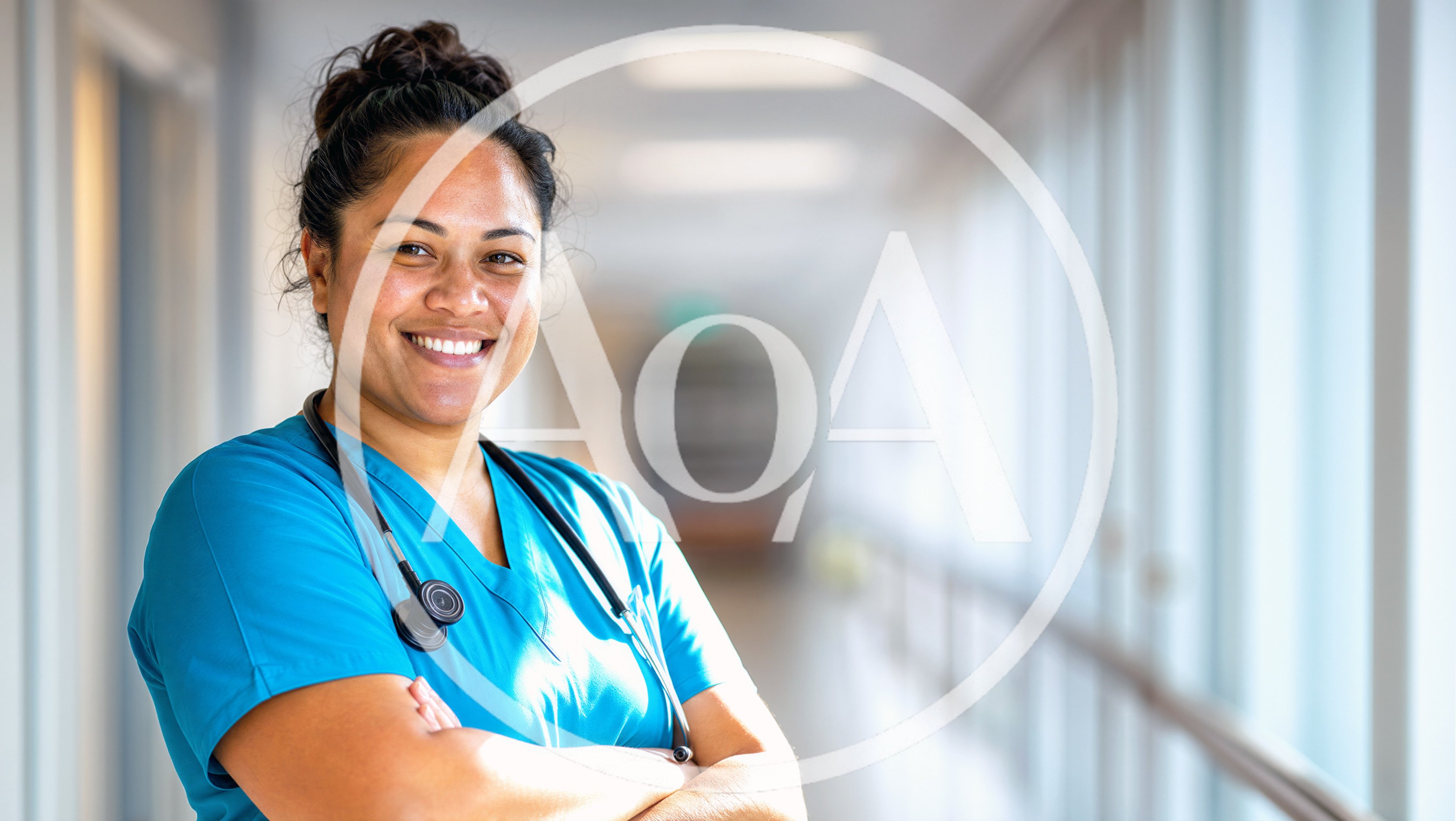Smiling Female Nurse Standing In Hospital Corridor
