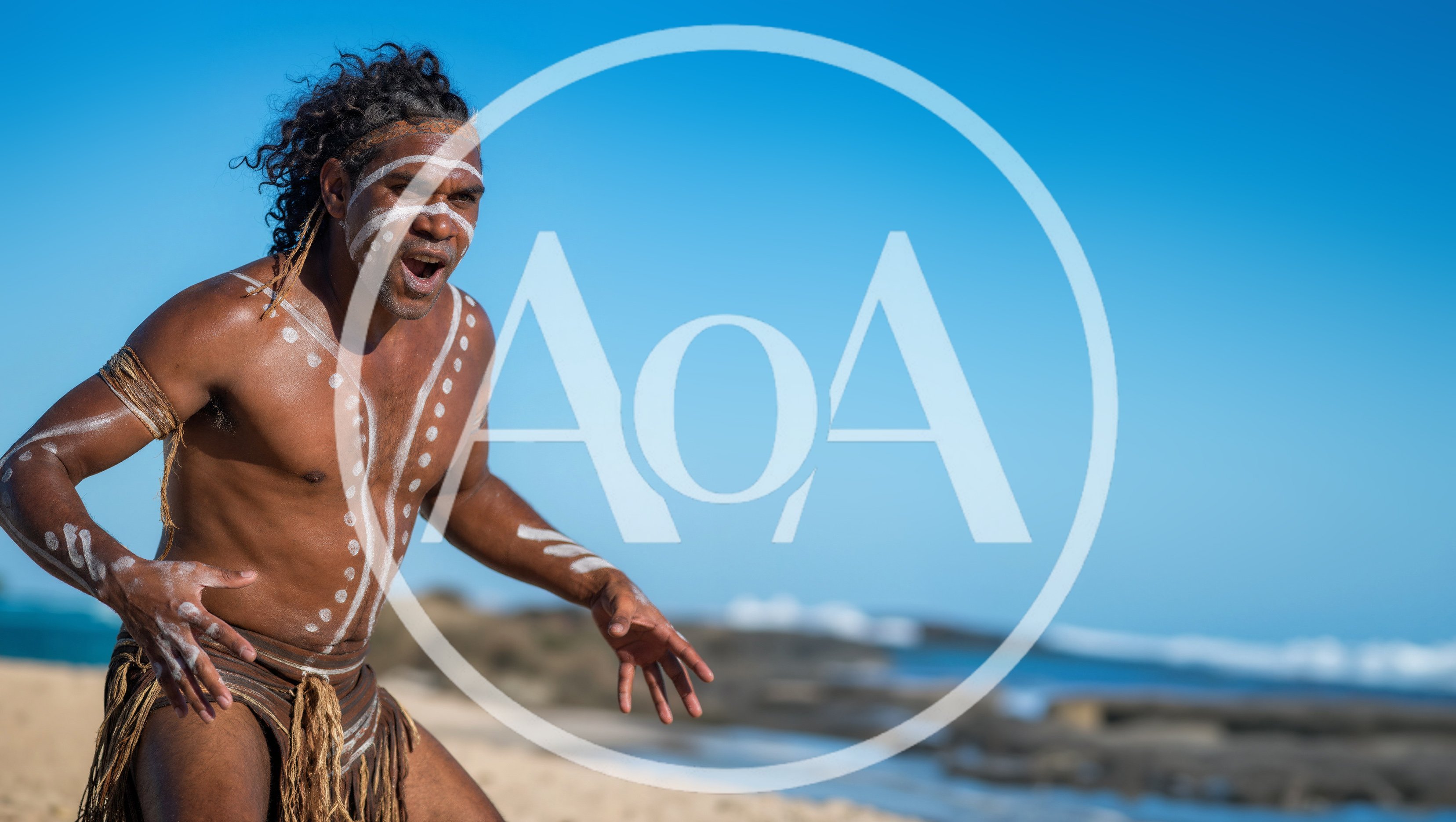 Indigenous Australian Man Performing Traditional Dance On Beach