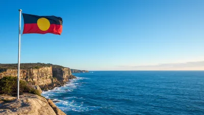Australian Aboriginal Flag Flying Over Coastal Cliffs